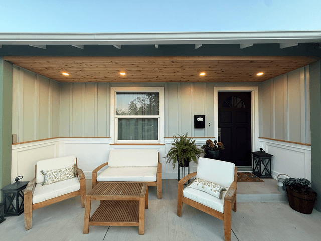 Porch renovation with wooden ceiling and matching wooden outdoor furniture